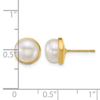 A pair of gold stud earrings with round white pearl tops, shown from front and side view against a measurement scale.