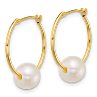Pair of gold hoop earrings with white pearl drops, shown against a white background.