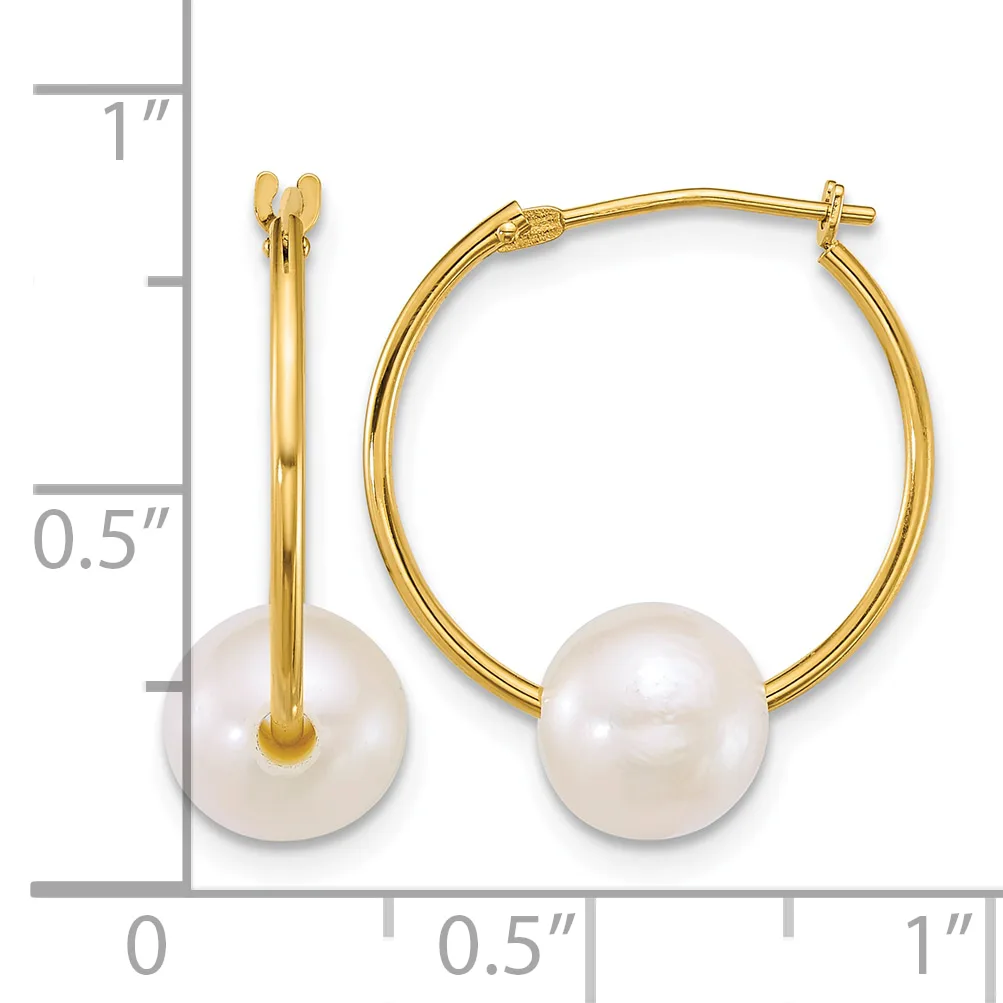 Gold hoop earrings with white pearl drops, shown next to a ruler indicating approximately one inch in length.