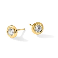 A pair of gold stud earrings with round bezels containing round diamonds, shown from the front against a white background.