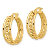 A pair of gold hoop earrings with ridged outer surfaces and beaded inner details, shown at different sizes side by side.