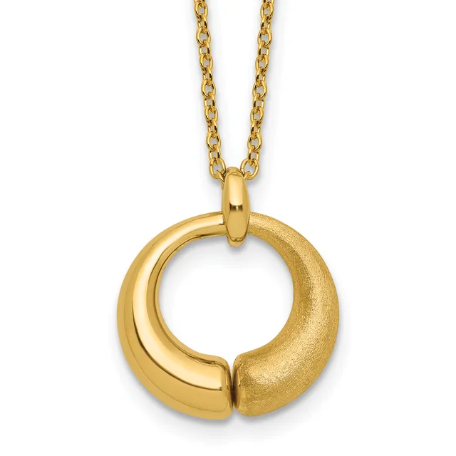 Gold circular pendant with a split design, one side polished and one side textured, hanging from a gold chain.