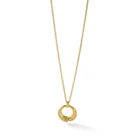 A gold chain necklace with a polished circular pendant featuring a split opening design, shown hanging against a white background.