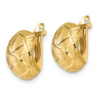 A pair of gold-colored chunky oval hug earrings with a textured diamond-cut pattern surface and hinged lever backs, shown from the front.