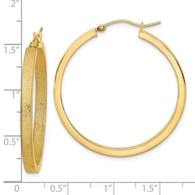 Pair of gold hoop earrings with a textured finish, shown from front and side views against a measurement scale indicating approximately 1.5 inches in diameter.