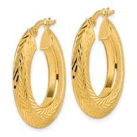 A pair of textured gold hoop earrings with a diagonal line pattern, shown from the front against a white background.