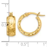 A pair of gold hoop earrings with a hammered texture finish, shown next to a measurement scale indicating approximately one inch in diameter.