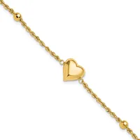 Gold-toned bracelet with a twisted chain design, featuring a polished heart charm in the center and small spherical beads at each end.