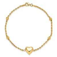 Gold-toned twisted chain bracelet with small spherical beads spaced throughout and a polished heart charm at the center, fastened with a lobster clasp.