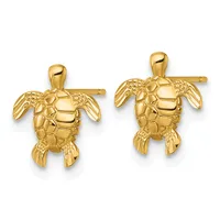 Two gold sea turtle stud earrings with detailed shell and flipper texturing, shown from above against a white background.