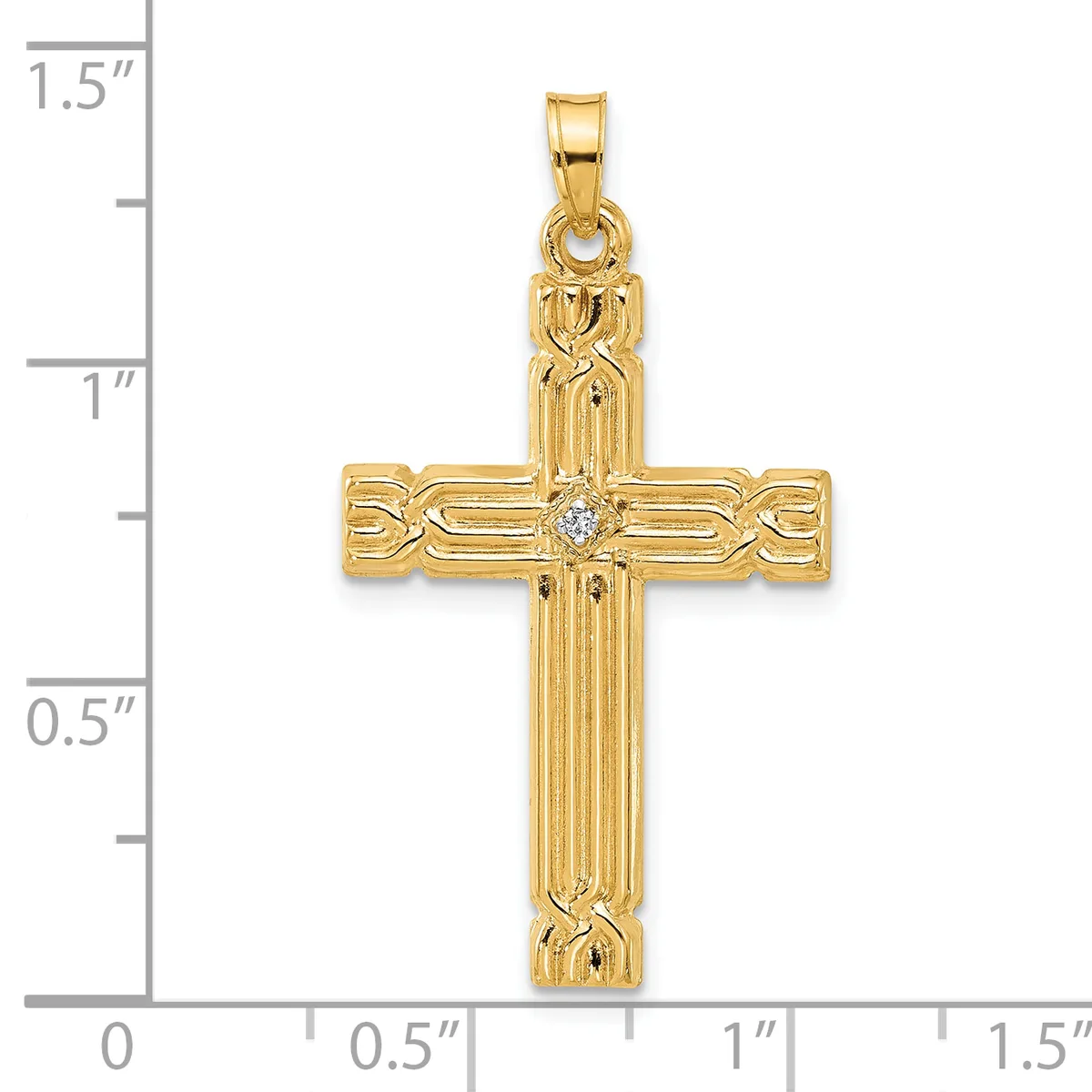 Gold cross pendant with vertical ribbed texture, decorative knot details at corners, and a small diamond at center, shown next to a measurement scale.