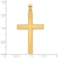 A gold cross pendant with textured surface and bail loop, shown against a ruler measuring approximately 1.9 inches in height and 1 inch in width.