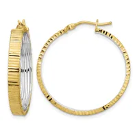 A pair of gold hoop earrings with a ridged texture on the outer surface and smooth inner surface, shown from front and side views.