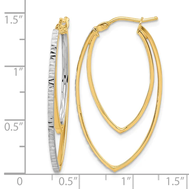 Two-tone gold oval hoop earrings with textured inner hoops and polished outer hoops, displayed next to a measurement scale showing approximately 1.25 inches in length.
