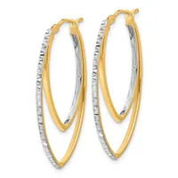 Pair of two-tone gold hoop earrings with textured silver outer loops and smooth gold inner loops, featuring hinged closures.