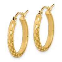 A pair of gold hoop earrings with textured surfaces and polished inner curves, shown from the front against a white background.