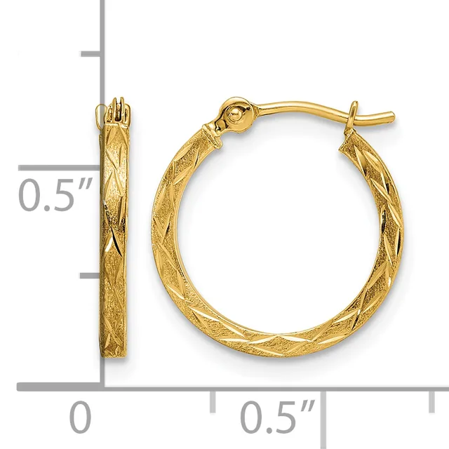 A pair of gold hoop earrings with a twisted textured surface, shown next to a ruler indicating they are approximately half an inch in diameter.