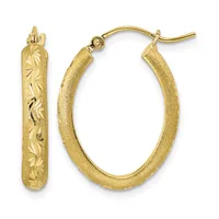 A pair of gold hoop earrings with textured and engraved leaf pattern designs, shown from front and side views.