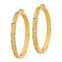 A pair of gold hoop earrings with textured geometric patterns on the outer edges and smooth polished surfaces on the inner curves.