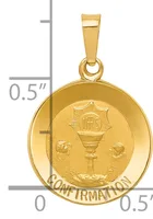 Gold-toned circular pendant with a chalice and rays design, labeled "CONFIRMATION" around the rim, shown next to a ruler indicating approximately 0.5 inches in diameter.