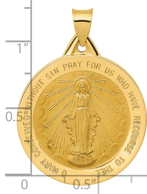 Gold medallion pendant featuring a central figure with radiating lines, surrounded by text around the rim, shown next to a ruler indicating approximately one inch in height.