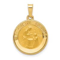 Gold circular pendant featuring a relief image of a robed figure holding a candle, with text around the outer rim, suspended from a gold bail.