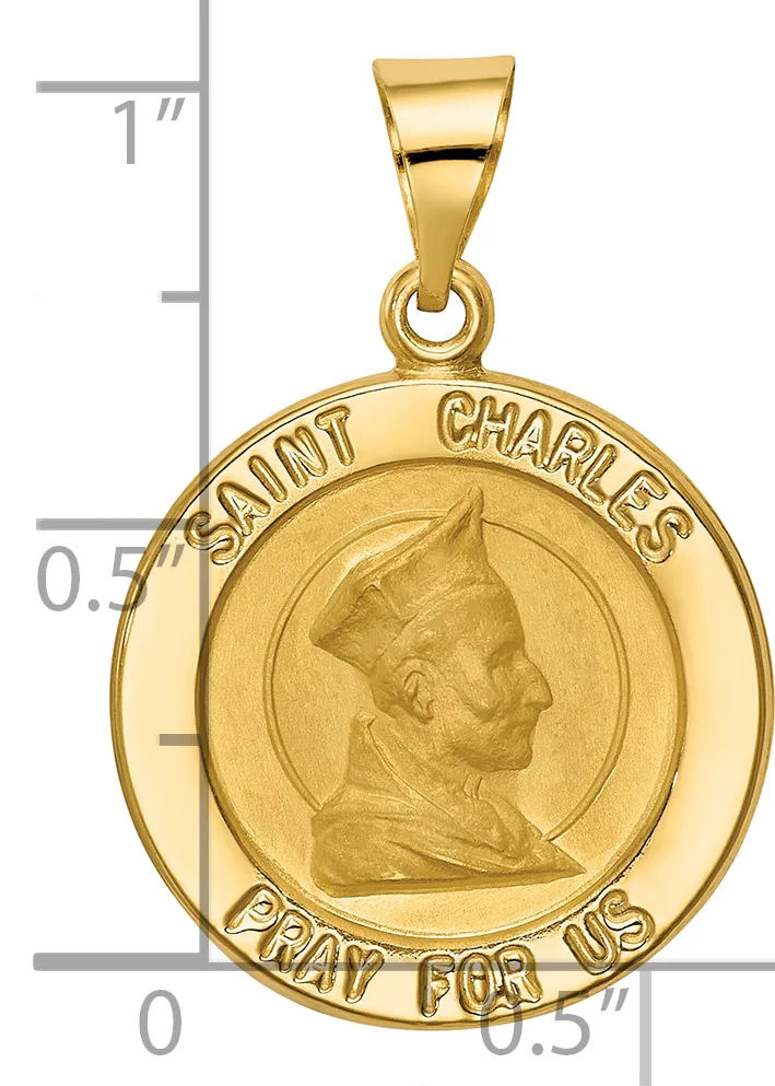 Gold round pendant featuring a profile portrait of Saint Charles with text around the border, shown next to a ruler for scale.