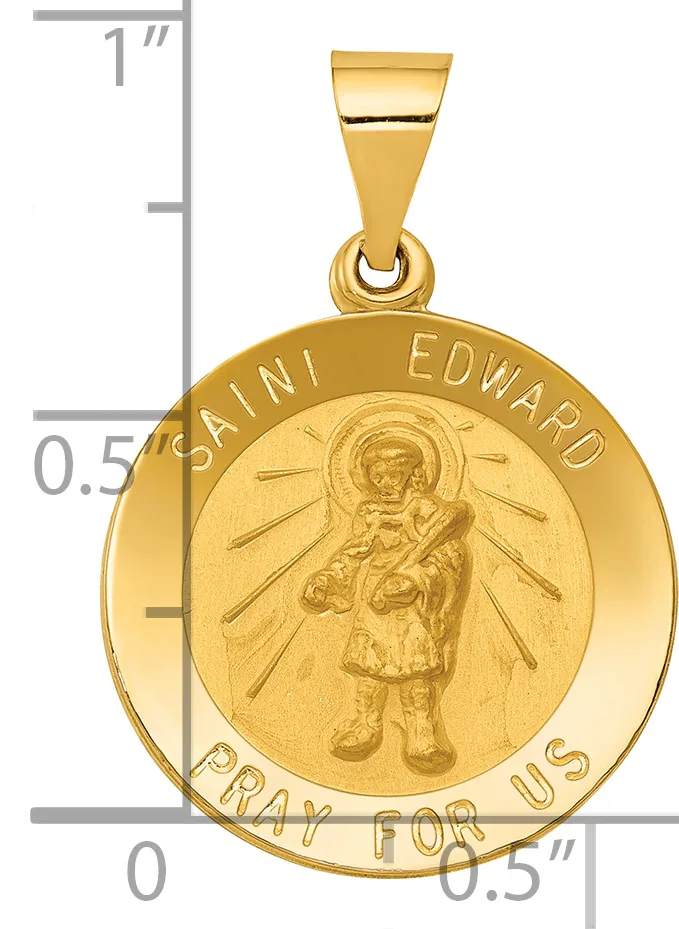 Gold-colored round medal pendant with Saint Edward holding a child, surrounded by radiating lines, with text around the border and a small hallmark, shown next to a ruler for scale.