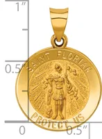 Gold pendant featuring Saint Florian standing with a spear, surrounded by text reading "Saint Florian Protect Us," displayed against a measurement scale.