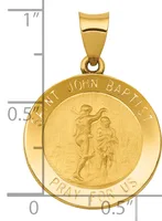 Gold round pendant featuring Saint John the Baptist carrying a child, suspended from a bail, shown next to a ruler indicating approximately one inch in height.