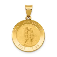 Gold circular pendant with a relief image of Saint John the Baptist holding a child, surrounded by text reading "SAINT JOHN BAPTIST" and "PRAY FOR US," suspended from a gold bail.