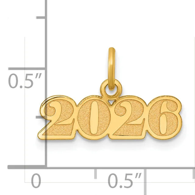 Gold pendant shaped like the year 2026 with a small attached loop at the top, shown next to a measurement scale indicating its size as approximately 0.5 inches tall and wide.