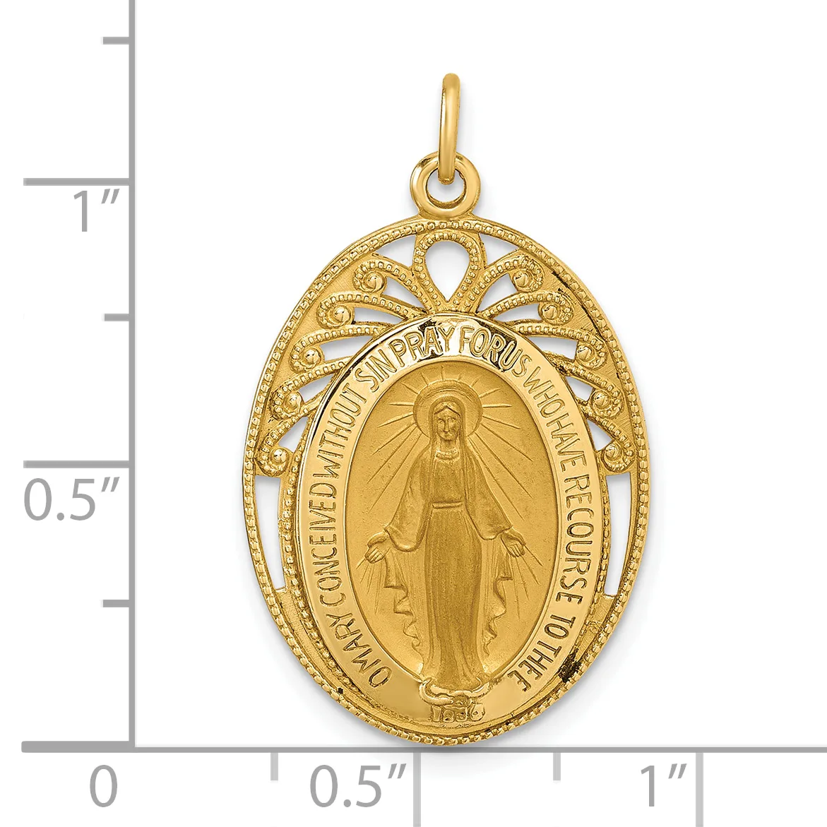 Gold-toned oval religious medal pendant with filigree border featuring a central figure with radiating lines, suspended from a small loop, shown against a ruler for scale.