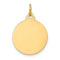 A polished gold circular pendant with a bail loop at the top and a small stamped hallmark on the lower surface.