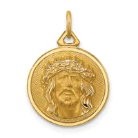 Gold pendant featuring a circular medallion with a relief portrait of Jesus wearing a crown of thorns, suspended from a gold bail.