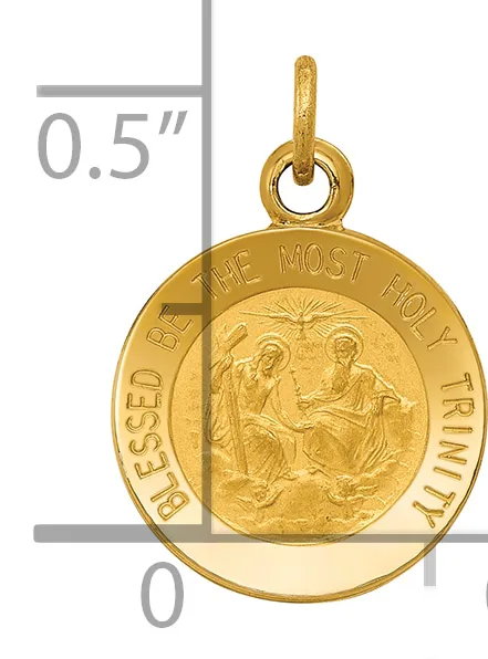 Gold-colored round pendant with religious imagery and text around the rim, shown next to a measurement ruler indicating approximately 0.5 inches in diameter.