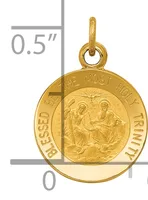 Gold-colored round pendant with religious imagery and text around the rim, shown next to a measurement ruler indicating approximately 0.5 inches in diameter.