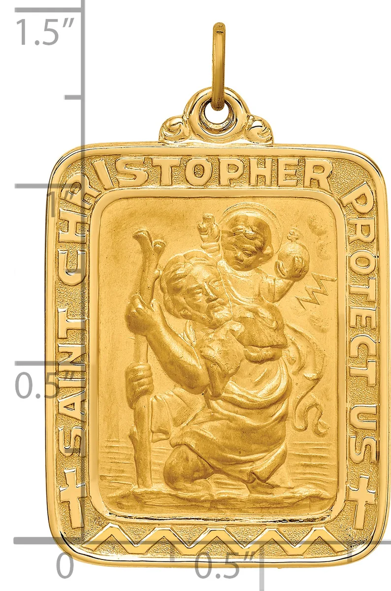 Gold rectangular pendant with rounded corners featuring Saint Christopher carrying Christ child in relief, surrounded by decorative border with text, shown next to ruler for scale.