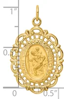 Gold religious medal pendant featuring an ornate oval frame with a relief image of Saint Christopher carrying Christ child, shown against a measurement scale.