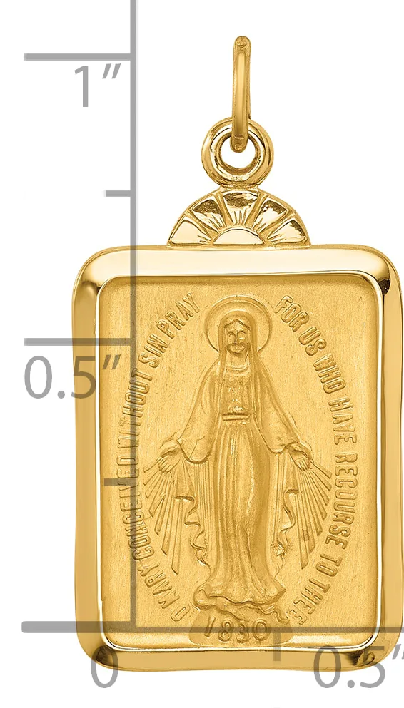 Gold rectangular pendant featuring a relief image of the Virgin Mary with outstretched hands, flanked by a decorative loop bail at top, shown against a measurement scale.