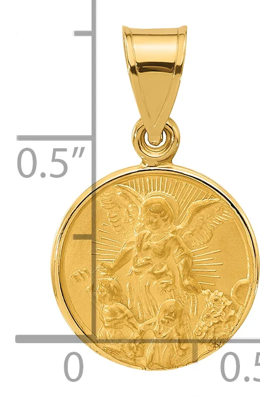 Gold pendant featuring a religious scene with an angel and saint figures in relief, shown next to a ruler for scale.