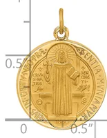 Gold-toned religious medal pendant featuring Saint Benedict in robes holding a cross and book, surrounded by text on an oval frame with a bail loop at top, shown next to a measurement scale.