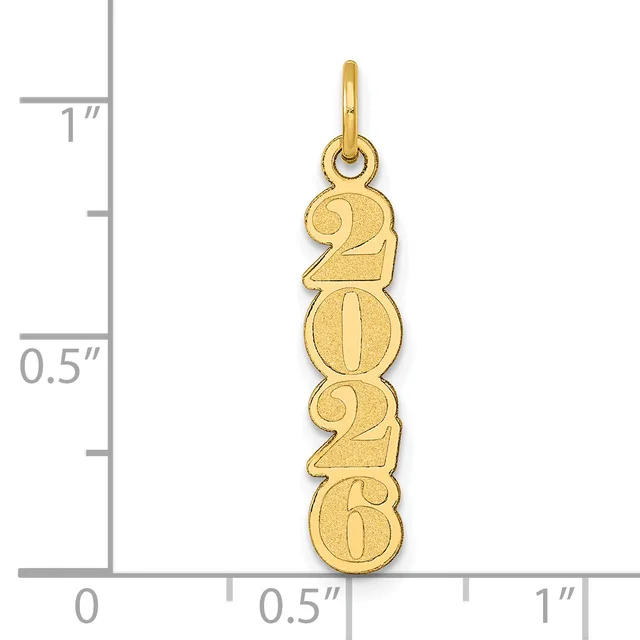 A gold vertical pendant charm stamped with the year 2024, displayed against a measurement scale showing approximately one inch in height.