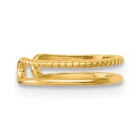 A gold-toned hinged bangle bracelet with a textured twisted pattern on the upper half and smooth polished surface on the lower half, shown open against a white background.