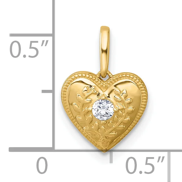 Gold heart pendant with leaf engraving and a round white gemstone in the center, shown next to a measurement scale indicating approximately 0.5 inches in height and width.