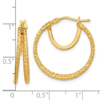Pair of gold hoop earrings with textured surface and post backs, displayed next to a ruler showing approximately one inch in length.