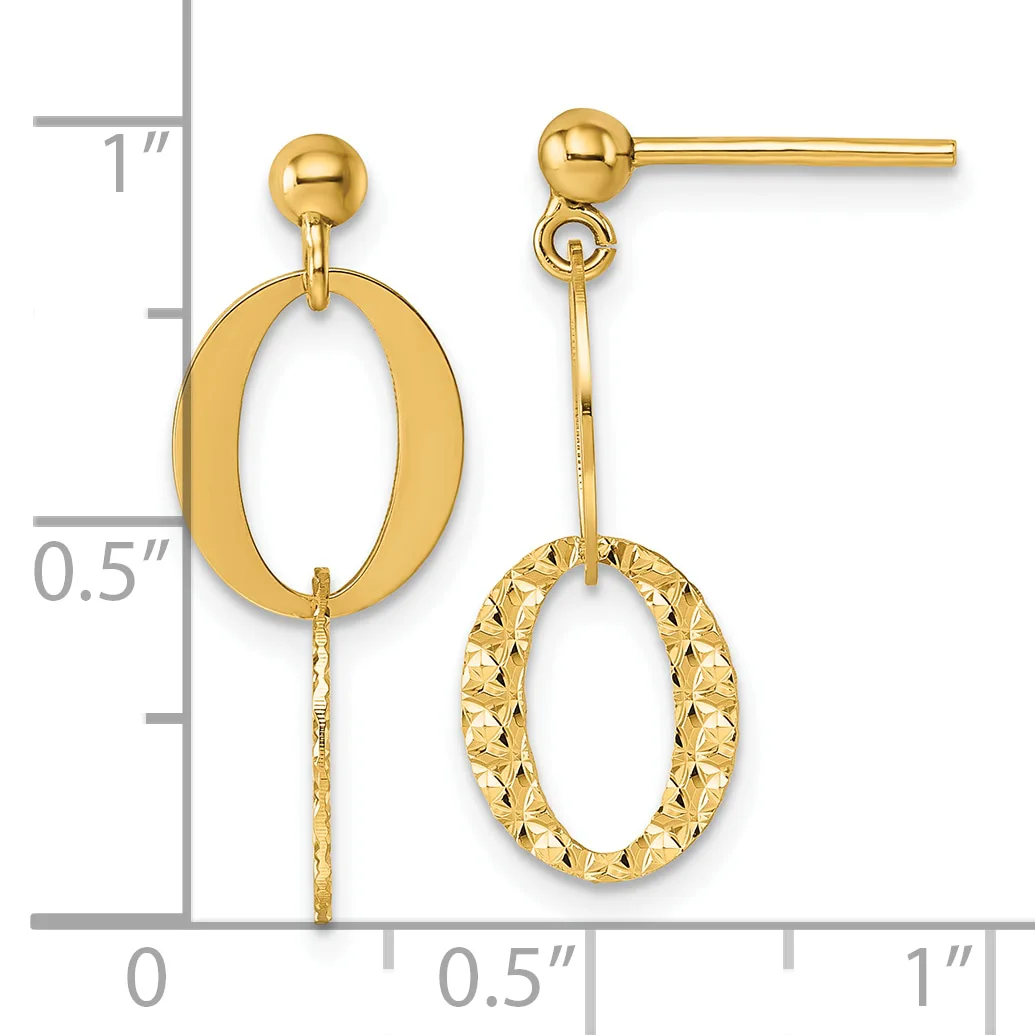 Pair of gold drop earrings with polished oval tops and textured oval pendants hanging below, displayed against a measurement ruler.