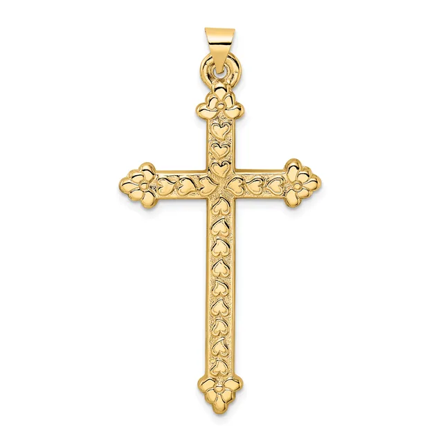 A gold cross pendant with ornate floral filigree detailing on the arms and shaft, displayed against a white background.