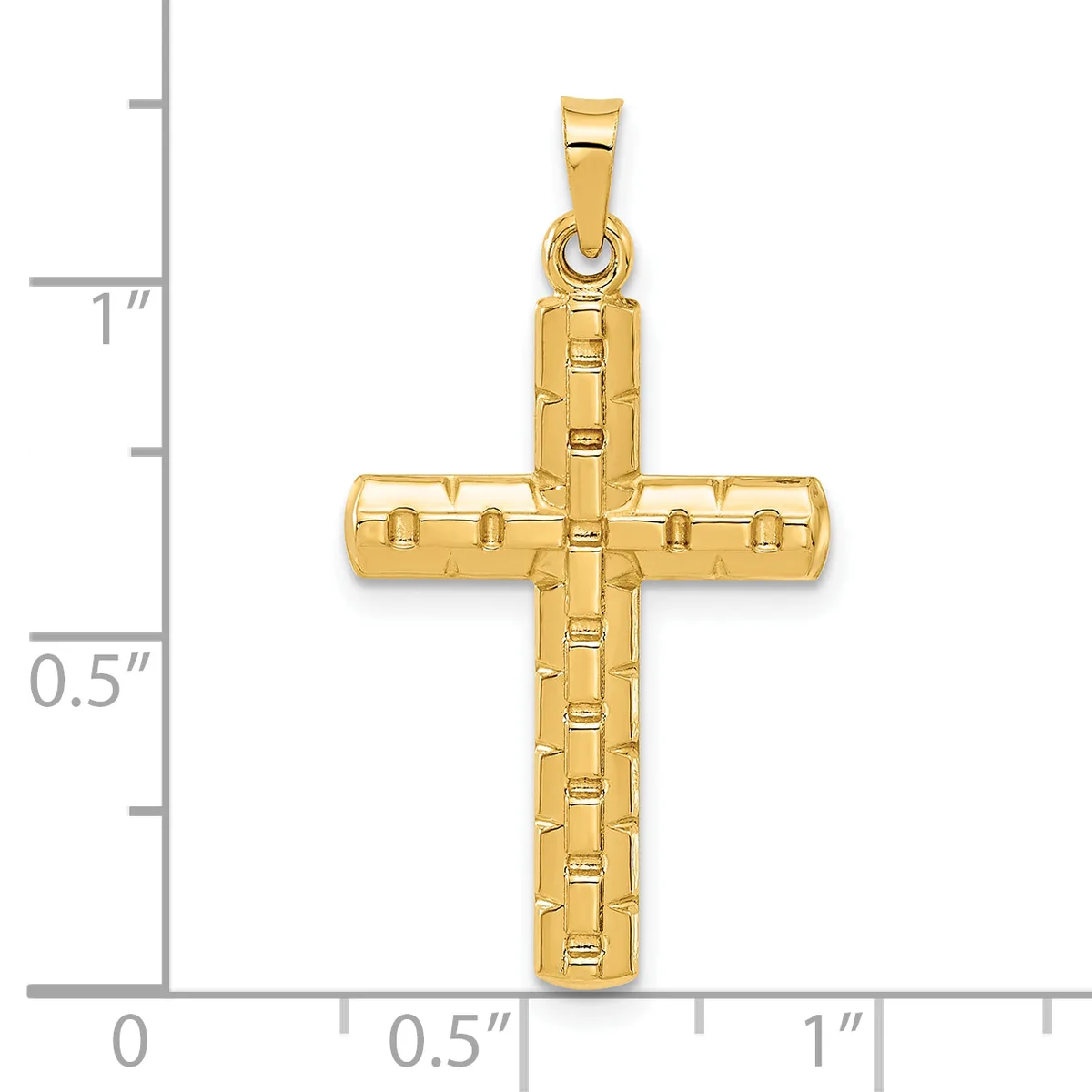 Gold cross pendant with textured rectangular surface and rounded edges, shown against a measurement scale indicating approximately one inch in height.