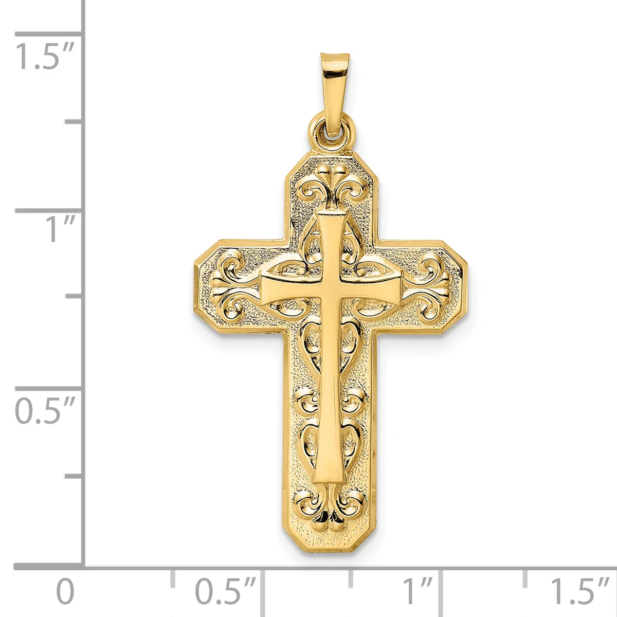 Gold-colored cross pendant with ornate filigree detailing and a smaller cross cutout in the center, shown next to a ruler measuring approximately 1.25 inches tall.